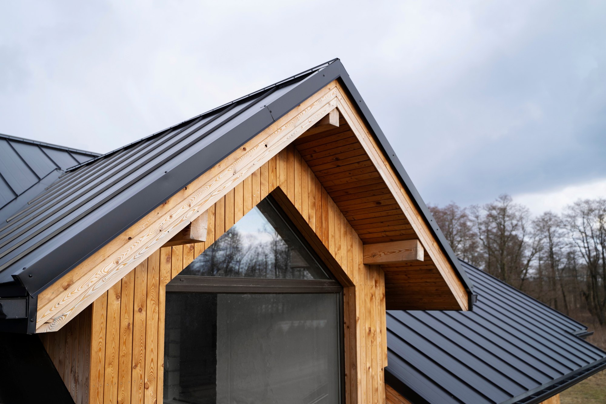 Timber gable with a new standing-seam metal roof